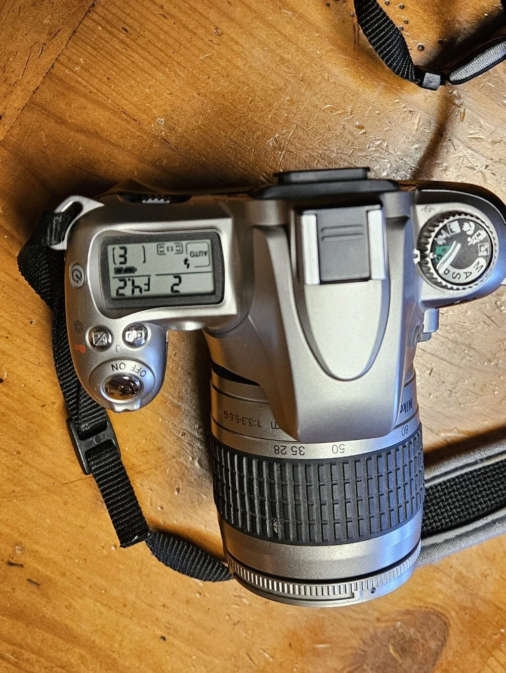 Nikon N55 35mm SLR Film Camera with Black Zoom Lens and Strap